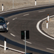 Photo of an electric car on a wireless charging road